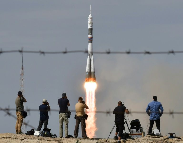 Photographers snap away as the three-strong crew blasts off from the Baikonur cosmodrome bound for the International Space Station, which has been orbiting Earth at some 28,000 kph (17,000 mph)  since 1998 (AFP / Vyacheslav OSELEDKO/ MANILA BULLETIN)